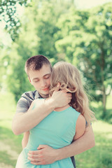 Fototapeta premium Lovely young couple in love, man embracing woman, warm feelings,