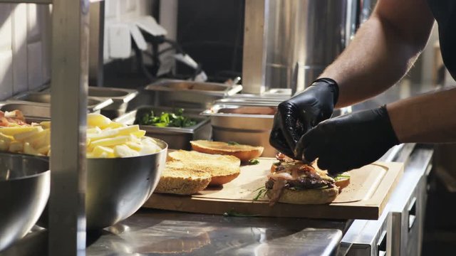 Adding Tomatoes to Burgers