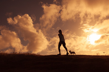 Woman and dog walking. 