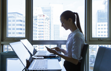 Businesswoman working in a office setting. 