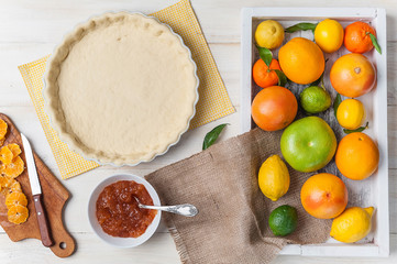 production of cake with citrus marmalade and slices of mandarin