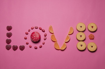 marmaladeand cookies and sweets food art love for valentine's day isolated on pink