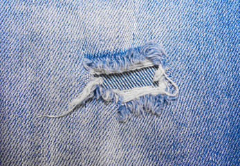 The hole on the blue jeans