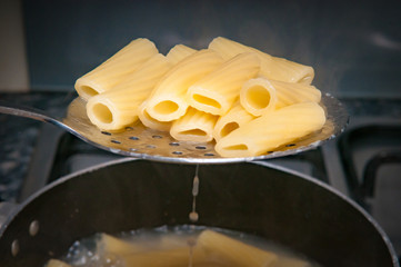 cooking fresh pasta in a pot on the hob