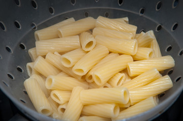 cooking fresh pasta in a pot on the hob