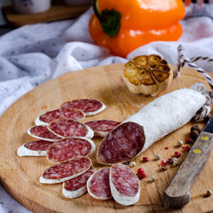 Salami on the kitchen Board, cut into slices