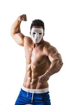Shirtless muscle man with creepy, scary mask being aggressive and violent, isolated on white background