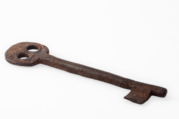 Antique rusty key isolated on white background