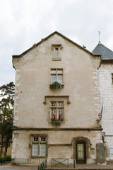 Mairie d'Aix-les-Bains City Hall building facade with the entrance door and French flags