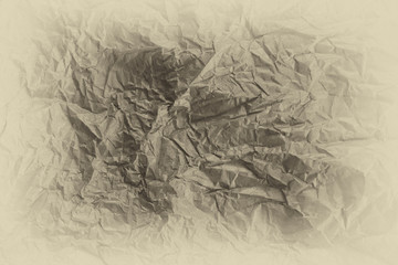 Texture of beige wrinkle paper with vignette effect as backgroun