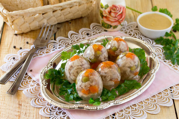 Appetizer Jellied eggs with carrots and green peas, jelly meat o