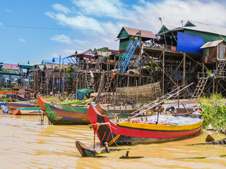 Fototapeta na wymiar Boats and stilt houses in Kampong Phluk floating village, Tonle Sap lake, Siem Reap Province, Cambodia 