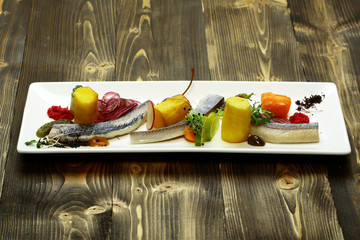 Delicious snack of pickled herring