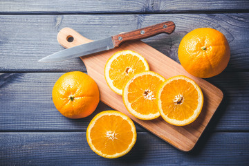 Orange sliced on wooden table. Natural orange juice.
