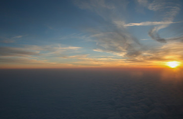 Fototapeta premium blue sky with white fluffy clouds and morning from airplane for