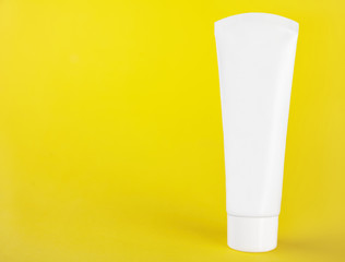 white plastic tube without labels, containers for cream or tooth