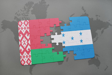 puzzle with the national flag of belarus and honduras on a world map