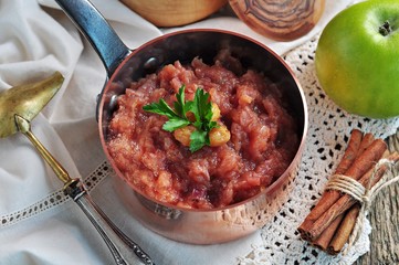 Homemade apple chutney with raisins, cinnamon, chili and other spices.