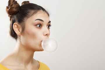 Portrait woman with bubble of gum