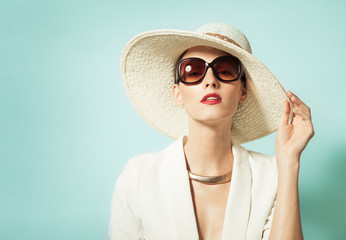 Fashion portrait of attractive woman posing in studio. 