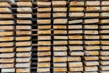 Stack of lumber wood in timber logs storage, A material for architectural and structural construction or industrial work.