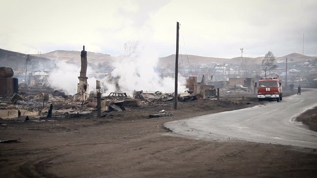 View of the Burned Village and a Fire Engine