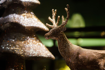 decorative gold toy Christmas deer. clouse-up