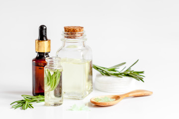 organic cosmetics with extracts of herbs rosemary on white background