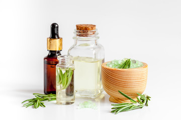 organic cosmetics with extracts of herbs rosemary on white background