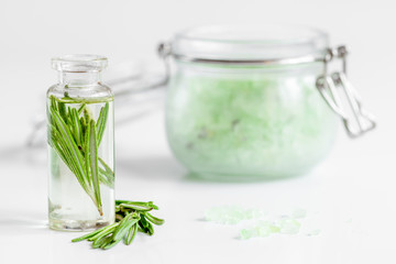 organic cosmetics with extracts of herbs rosemary on white background