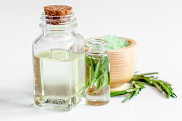 organic cosmetics with extracts of herbs rosemary on white background