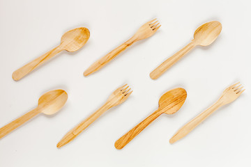 wooden kitchen utensils on white background top view pattern