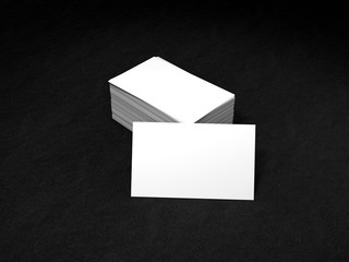 Stack of white business cards. Namecards mockup template on black leather background. 3D Rendering