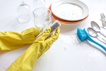 concept of woman washing dishes on white background