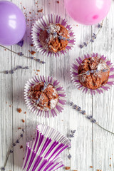 concept of Valentine's Day cupcakes wooden background top view