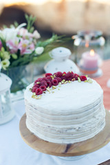 Fototapeta na wymiar Beautiful white wedding cake with berries