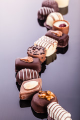 Pralines path on black surface