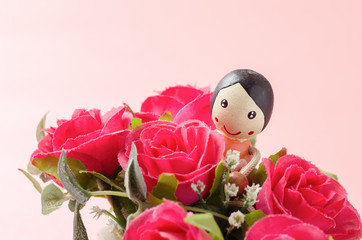 Red roses and doll on pink background,Valentine day concept