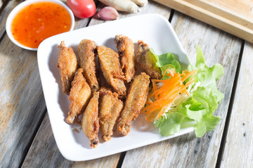 Chicken wings, fried foods (Thailand).