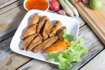 Chicken wings, fried foods (Thailand).