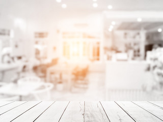 White above wood floor focus to table top in the foreground. Abstract blurred of restaurant shop pastel background. Counter cafes and coffee service. Food and Beverage Modern. - 133853006