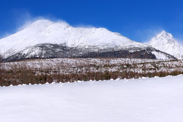Fototapeta premium View of the High Tatras mountains with the peaks covered with snow from Horny Smokovec. Slovakia.