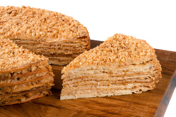 napoleon cake on a cutting board isolated white background