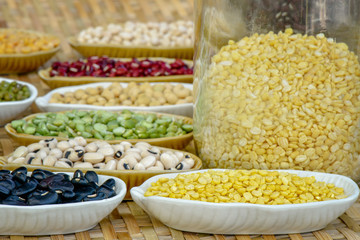 Dried mung bean on ceramic plate with different dry legumes