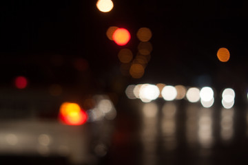 Blurred. The light from the cars on the road at night. Light is out of focus.
