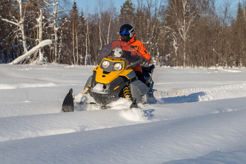 Athlete on a snowmobile