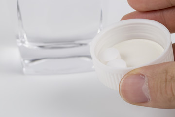 White pills and water