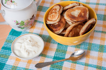 Delicious pancakes with sour cream for breakfast