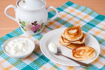 Delicious pancakes with sour cream for breakfast
