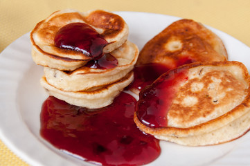 Delicious pancakes for breakfast with cherry jam